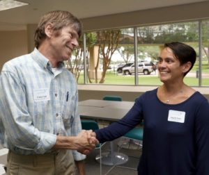 Carter Tull of the Galveston County MUD #12 visits with Angela Batiz with LJA Engineering